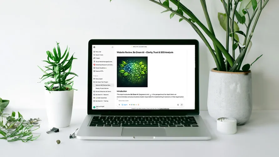 A laptop on a white desk surrounded by plants